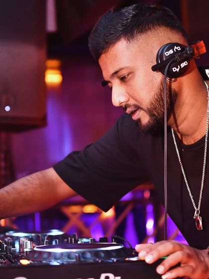 A close-up of me focused on the mix. Dream big, set goals, take action.