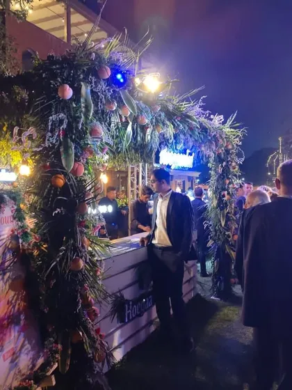 Guests arriving at our lushly decorated bar station during a large evening event. Our professional staff ensures that service is quick, friendly, and keeps the party atmosphere alive all night long.