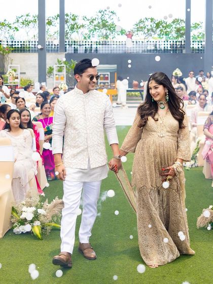 The couple's grand entrance, with her looking absolutely radiant and glowing.