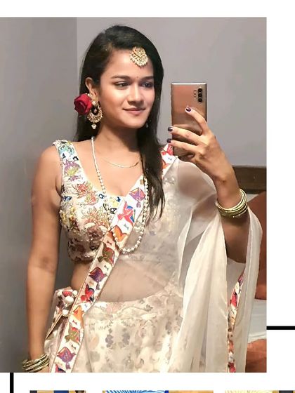 A selfie moment from our client in the white floral lehenga. It's a fun, fresh, and youthful choice for a mehendi or haldi ceremony.