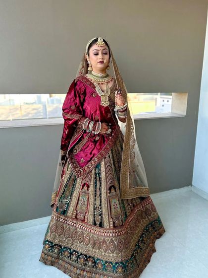 This bride's look is regal and timeless. The makeup complements her multi-toned lehenga, with a focus on flawless skin and defined features.
