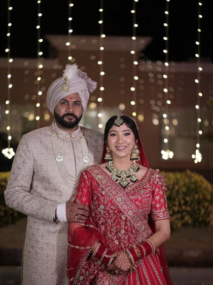 A stunning portrait of the happy couple. Kashish's radiant makeup shines beautifully against the backdrop of the festive lights.