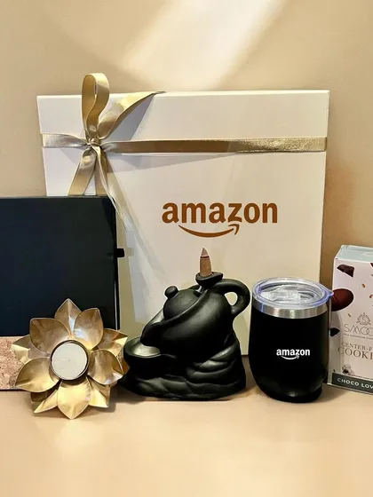 I partner with leading companies like Amazon to create impactful corporate gifts. This Diwali hamper features branded essentials like a tumbler and diary, paired with festive items like a backflow incense fountain and gourmet treats.