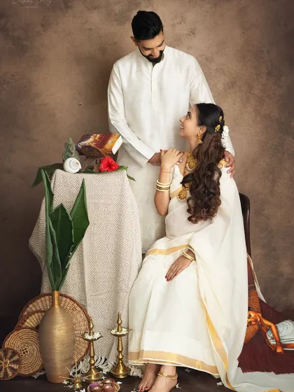 I have a special place in my heart for traditional shoots. Here, a couple is styled in classic white attire for a Keralan-themed session, creating a portrait that feels like a timeless painting, rich with cultural heritage and love.
