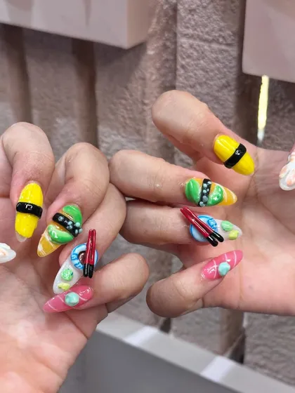 Another angle of the playful and unique sushi nail extensions. This kind of custom 3D work is our specialty and we love bringing your fun ideas to life.