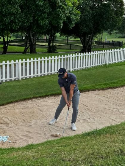 A bunker shot demonstration. Mastering every type of shot is critical, and my coaches learn from experts who teach players on international tours.