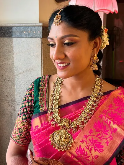 A close-up of the makeup I did for this bride-to-be. The smoked wing liner beautifully defines her eyes, while the skin remains fresh and natural. The gold jewelry adds a warm glow.