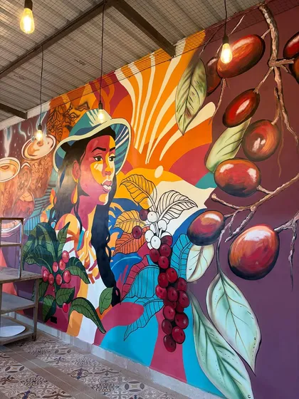 This vibrant, full-wall mural was designed for a cafe space, telling the story of coffee from bean to cup. It shows how I can use bold colors and illustrative styles to create an energetic and welcoming atmosphere for customers.