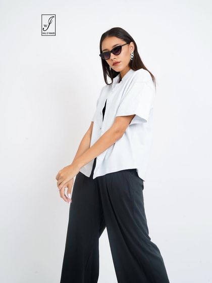 A dynamic pose that adds movement and interest to a standard e-commerce shot.