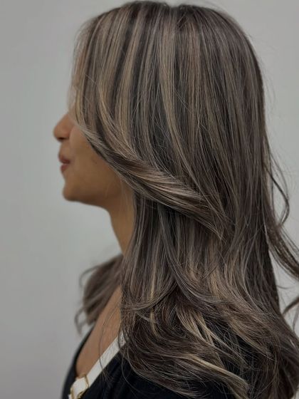 Another side profile, capturing the elegance of the ash tones and soft layers.
