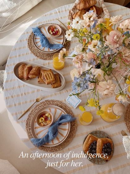 An afternoon of indulgence, just for her. The beautifully set table for our Mother's Day brunch, complete with fresh flowers and pastries, shows our attention to detail.