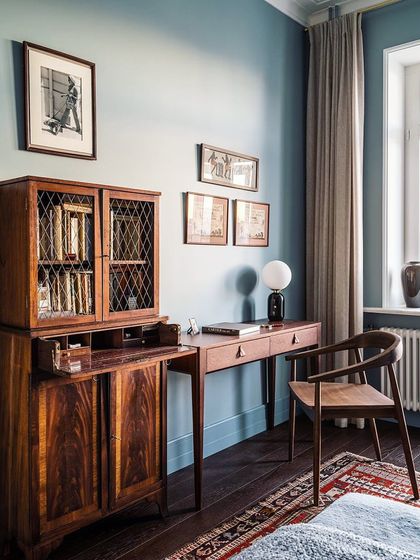 Sometimes, the furniture itself is the statement. This image showcases a study or reading nook with beautiful solid wood furniture, proving that quality pieces can define a room.