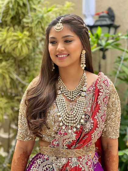 Kicking off this bride's wedding celebrations with a stunning look. The makeup is soft and glamorous, with a focus on radiant skin and beautifully defined eyes.