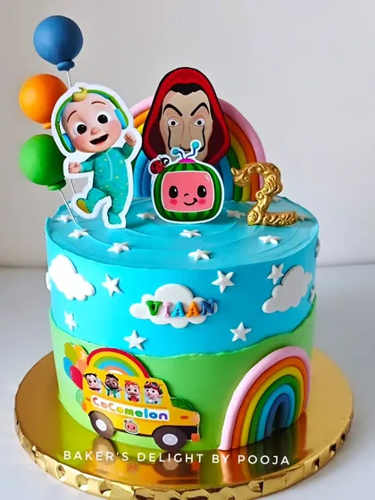 A unique mashup for a second birthday, this cake combines the colorful world of Cocomelon with a surprising Money Heist twist. It's a great example of how I can blend different themes to create a truly personal cake.
