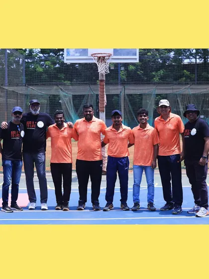 Our coaching staff taking a moment together on the court. The bond between our coaches is the foundation of our academy's leadership.
