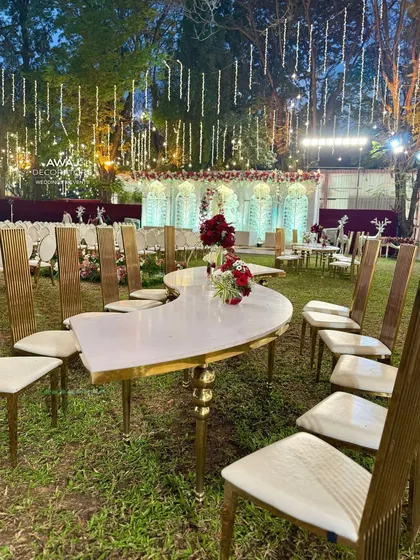 A full view of the outdoor dining area, with a mix of table shapes and elegant seating, all unified by a classic color palette.
