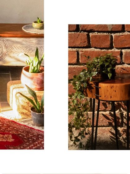 The morning sun highlights the textures of the space, from the rough brick wall to the smooth wooden side table and the woven rug.