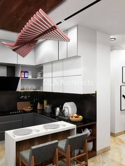 Another view of the kitchen design, showing the layout and flow from the main cooking area to the breakfast bar.