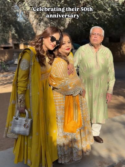 A beautiful family moment. The client is celebrating her parents' 50th anniversary at the Haldi ceremony, and her makeup is fresh and radiant.