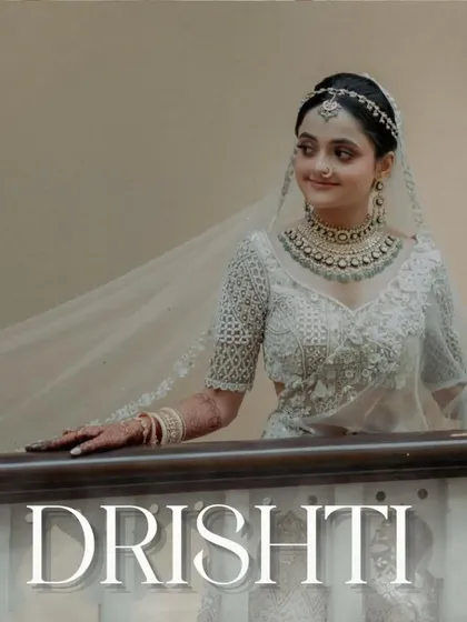 A stunning portrait of the bride, Drishti, looking ethereal in her all-white ensemble. A picture of pure grace.