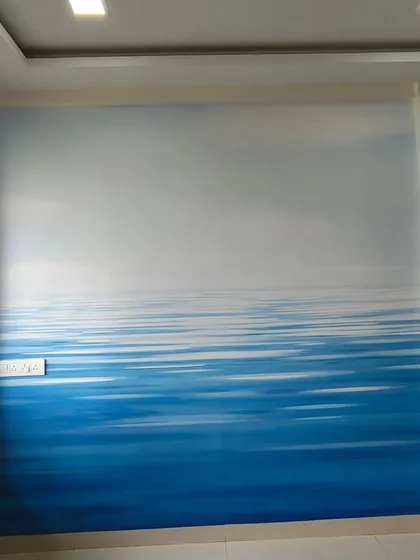 An abstract seascape mural that creates a sense of calm and openness. The gradient from deep blue to a light sky makes the room feel larger and more serene.