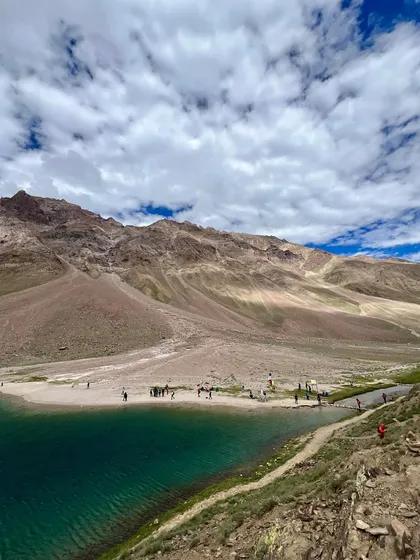 Another stunning view of Chandratal Lake, where the mountains of Spiti are reflected in the calm, blue water.