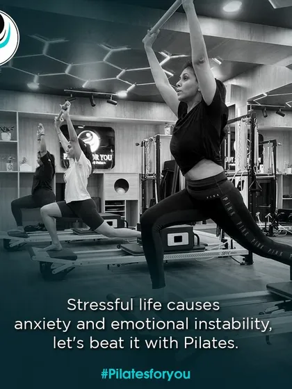 A stressful life can cause anxiety, but we can beat it with Pilates. These clients are finding their focus and strength during a group reformer class.
