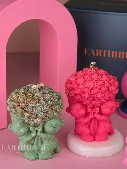 A candle for someone you love. This design features two teddy bears holding a giant bouquet of roses.