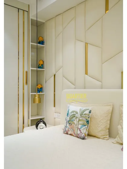 This image shows the clever use of space in the Tata LaVida bedroom, with built-in open shelving next to the bed for display and easy access to nighttime essentials.
