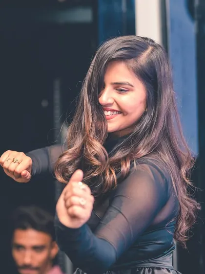 A guest dancing with a smile.