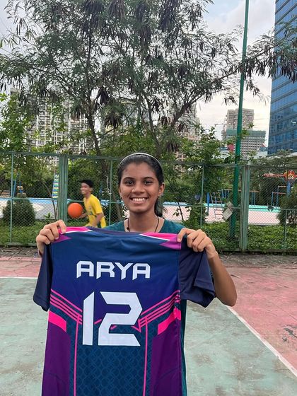 Welcoming Arya to our Maniac basketball community. She's holding her new jersey and is ready to train.