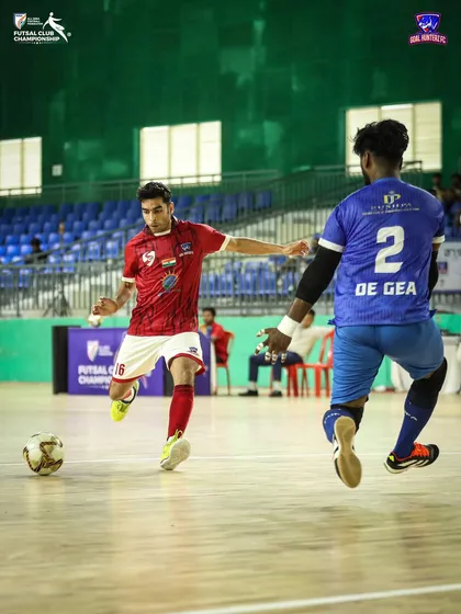 A player taking on a defender during the second group stage match.