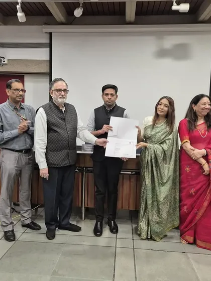 Presenting a certificate to a participant at the legislative drafting workshop conducted by the Institute of Constitutional and Parliamentary Studies (ICPS). It is rewarding to see officials enhance their skills in this critical area of law.