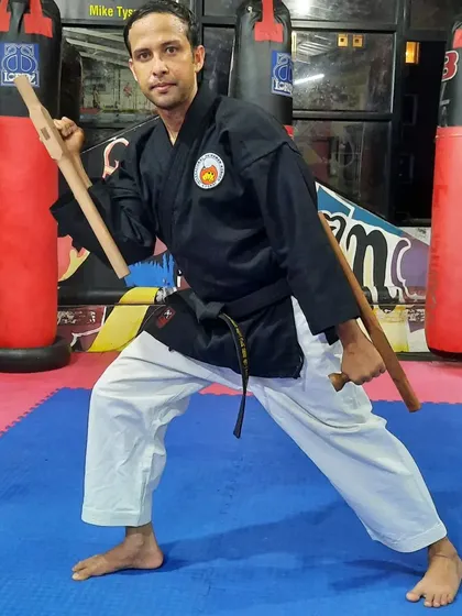 This is a ready stance with the Tonfa, another core weapon in the Jinbukan Kobudo system. My classes cover the practical application and traditional kata associated with these effective self defense tools.