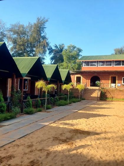 The comfortable and clean beachside cottages at our Gokarna stay.