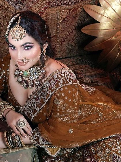 A full length portrait of a student's Arabic bridal creation. The opulent setting and professional photography are part of the portfolio building support I provide.