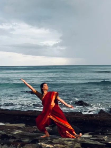 Feeling a sense of oneness with the universe while dancing on the rocky shores of Reunion Island. This image captures the spiritual connection between my art and nature.