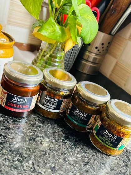 A lineup of our pickles and chutneys, ready to accompany any meal. From the tangy Chatpati Imli to the savory Grated Dal and the classic Mithila Special Mango, there's a flavor for every paratha.