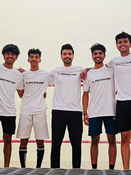 Me with some of my players, united as a team at the JSW Memorial Squash Open.