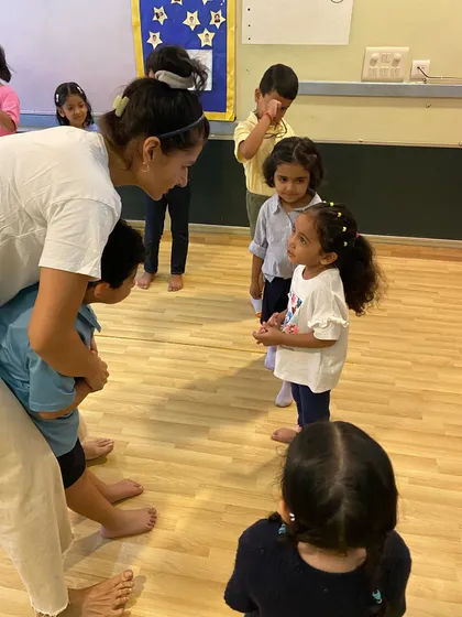A one-on-one moment of connection and instruction. I take the time to work with each child individually to help them find their voice.