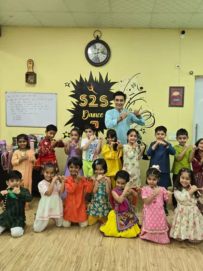 The entire kids' batch dressed in colorful traditional wear for Janmashtami. A beautiful moment of celebration and community.