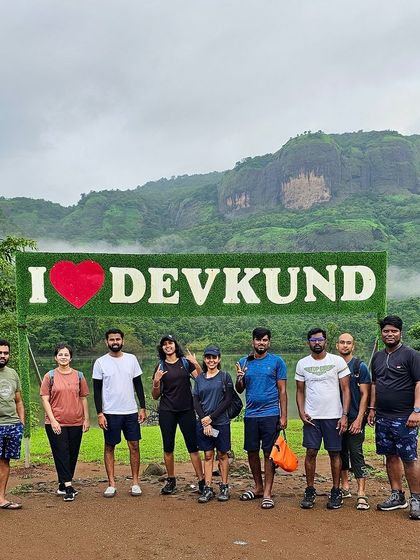 A great shot of the group at the "I Love Devkund" sign, a popular photo spot on our itinerary.