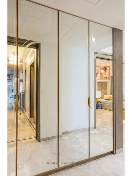 We love using mirrors to enhance a room's sense of space. These designer mirror wardrobe shutters reflect light and the room's decor, making the space feel larger and more elegant.