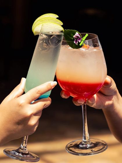 Cheers to summer! My refreshing cocktails are the ultimate rescue from the scorching heat. This image shows two of our colorful creations, perfect for sipping and chilling.