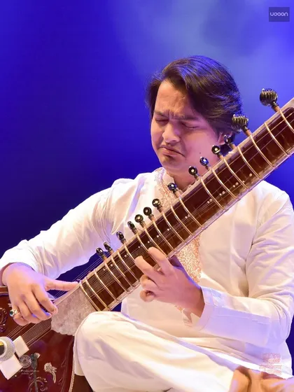 Deep in concentration during a complex phrase at the 'Udaan' concert. This photo shows the focus required to bring out the intricate beauty of a raga.