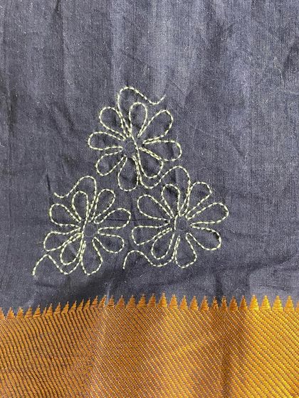 A detail of the floral motif created with Sashiko stitching. Even with a simple running stitch, it's possible to create such lovely, organic shapes.