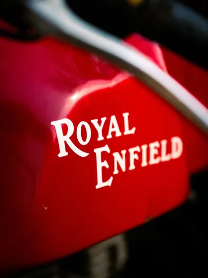 A clean, detailed shot of the iconic Royal Enfield logo. This kind of product-focused shot is great for brand collaborations.