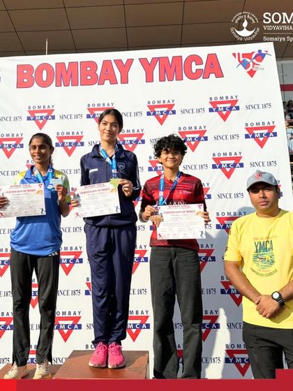 Our female athletes and their coach after a successful medal haul at the Bombay YMCA athletics meet.