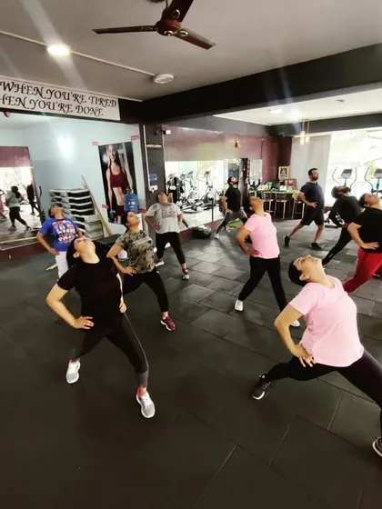 The concentration and energy during a stretching part of our aerobics class. Flexibility is just as important as strength.