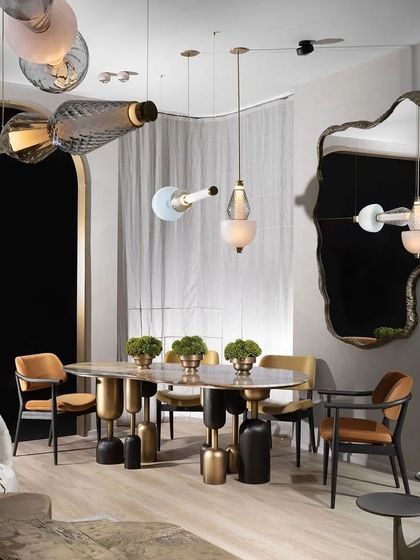 The dining area of our India Design 2024 stall, showcasing the sculptural Lotus Quartz table and our elegant dining chairs. The space was designed to highlight the intersection of art, craftsmanship, and functional design.